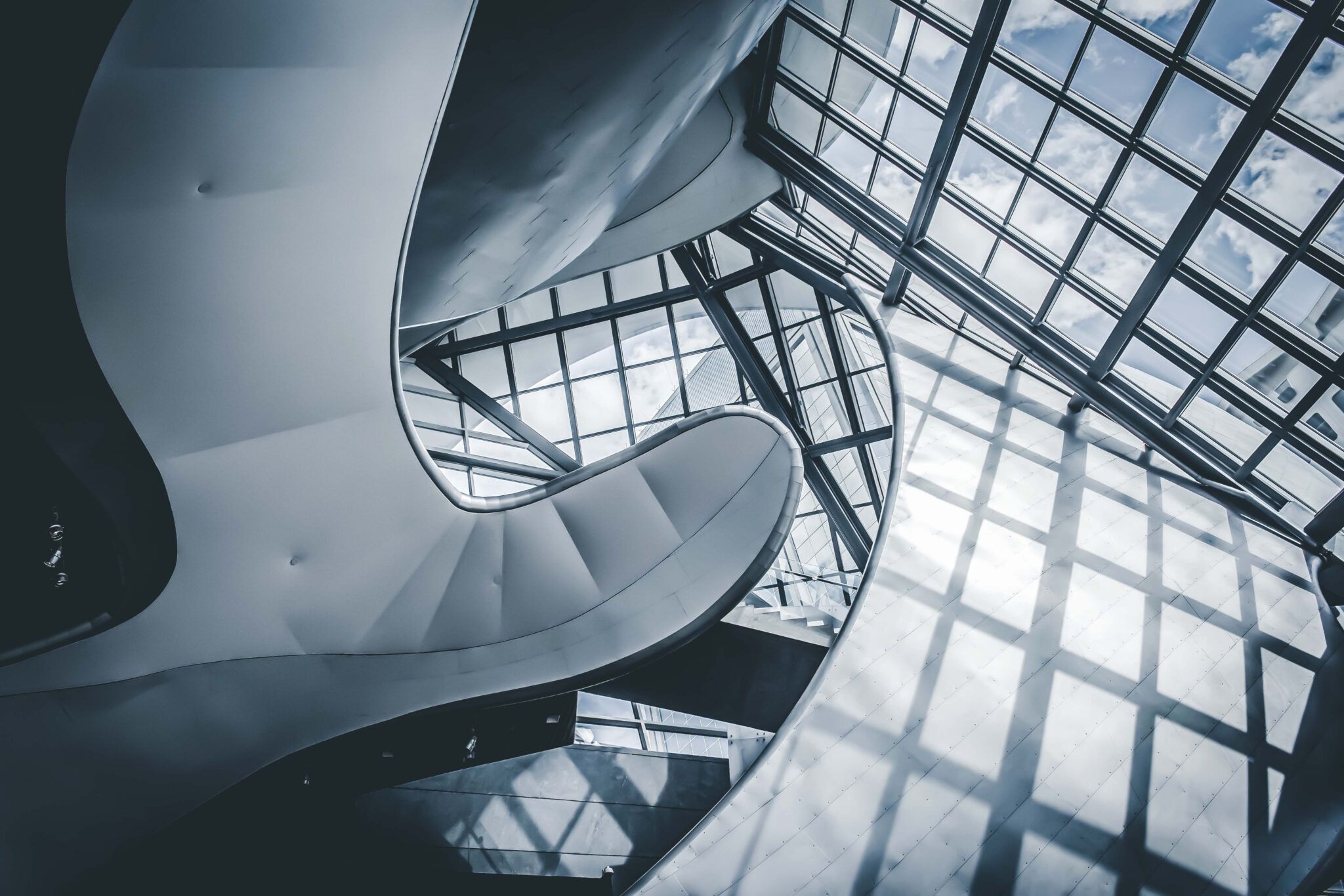 a spiral staircase with windows